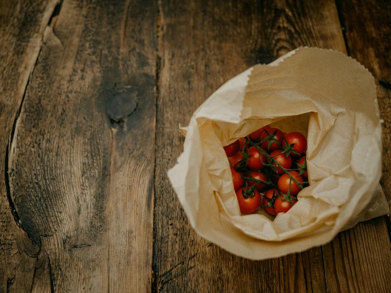 Beeswax wrap covering food and produce on a kitchen counter
