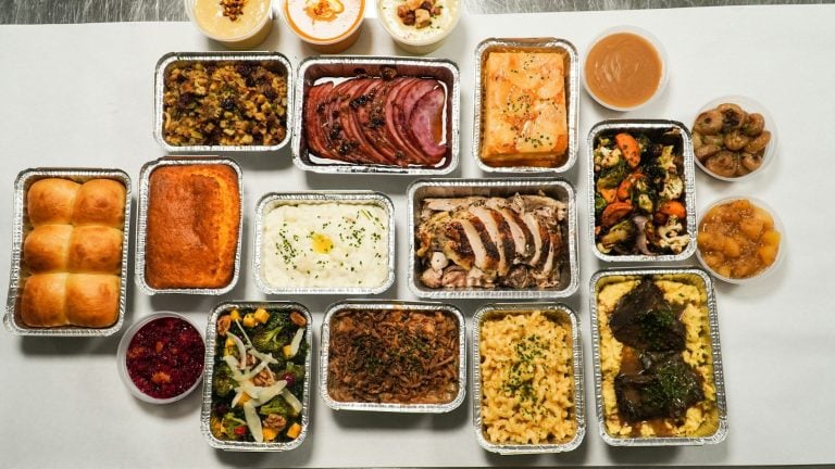 Thanksgiving side dishes laid out in trays, seen from above