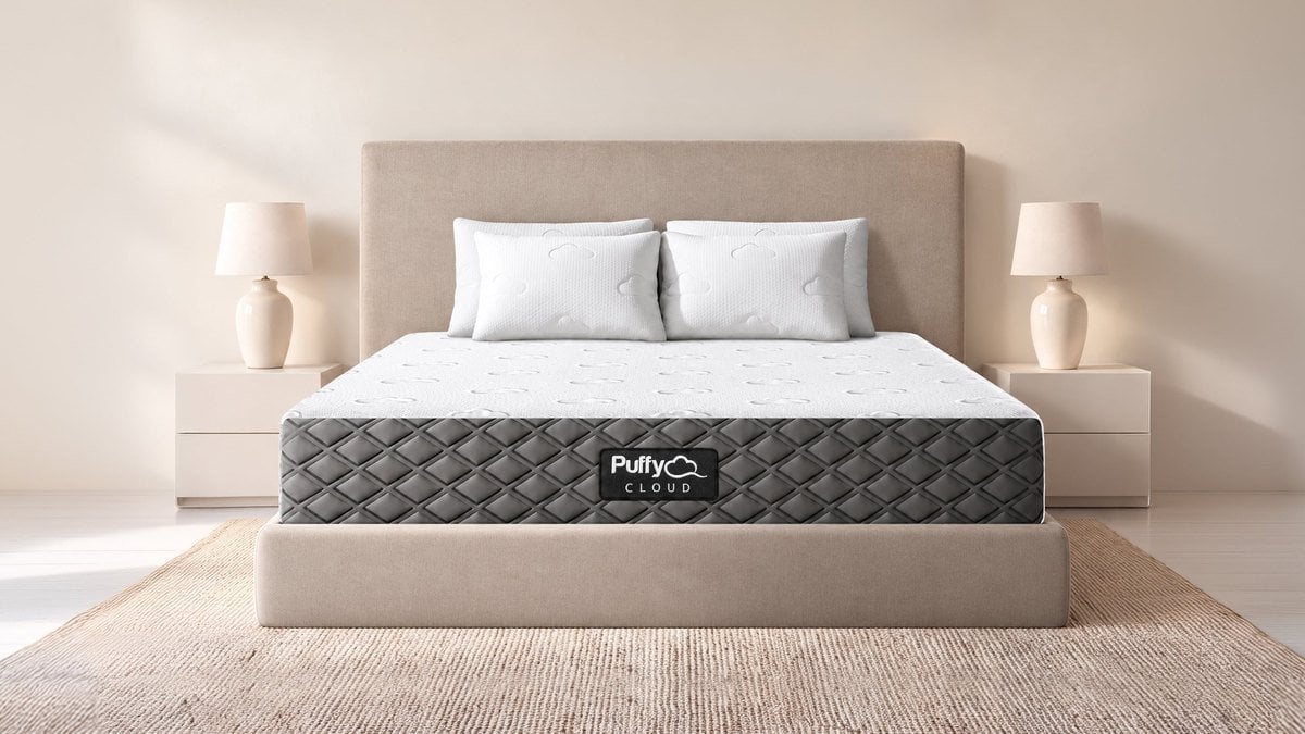 The Puffy Cloud mattress on an upholstered bed frame